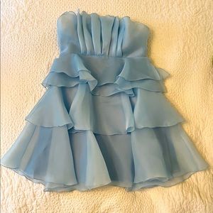 A baby blue strapless mini dress.